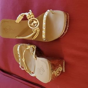 Baby Phat gold size 9 sandals. Never worn.